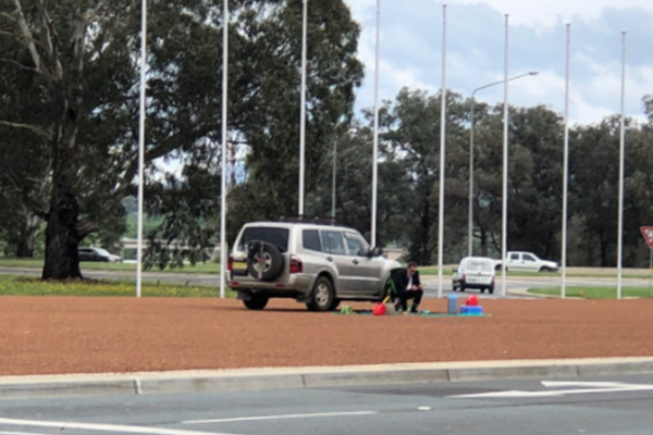 Article image for Man surrounds himself with petrol containers