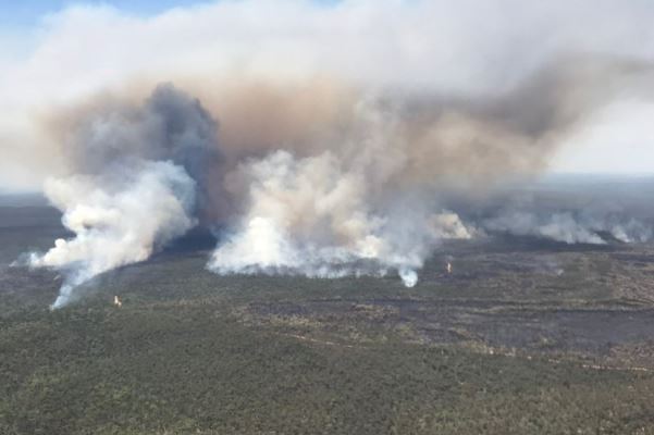Article image for Firefighters battle to contain 30 fires across the state
