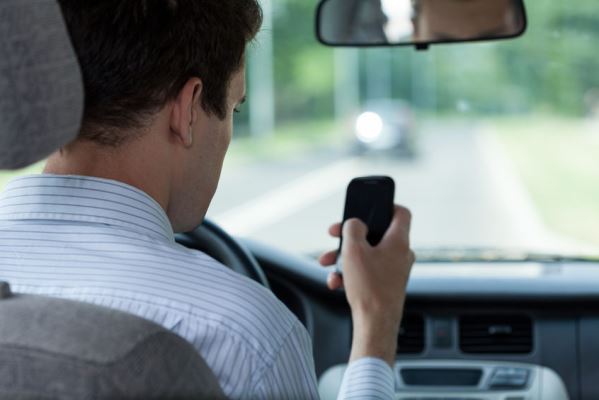 Article image for State-wide crackdown busts 1,200 drivers using their phones