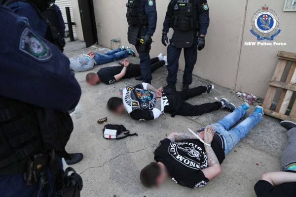 Article image for Extraordinary footage shows police restraining outlaw gang members