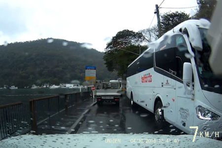 Coach bus ignores road signs, smashes three windows