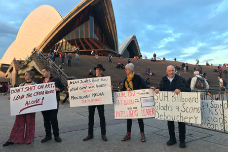Police ramp up security for Opera House light show as protesters gather