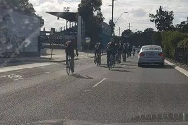 Article image for This image of cyclists ignoring a bike lane has drivers up in arms