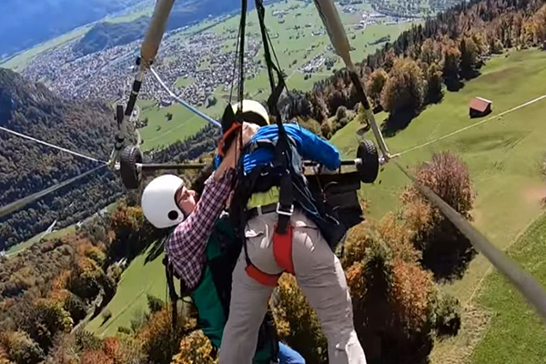 Article image for WATCH | Man hangs on for life after gliding instructor forgets to attach harness
