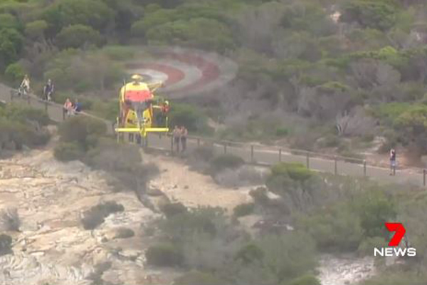 Article image for WATCH | Man winched from cliff edge after falling from walking track