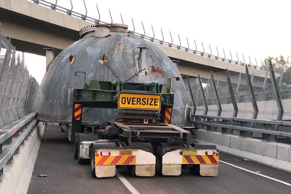Article image for Oversized truck trapped for hours after becoming wedged on off-ramp