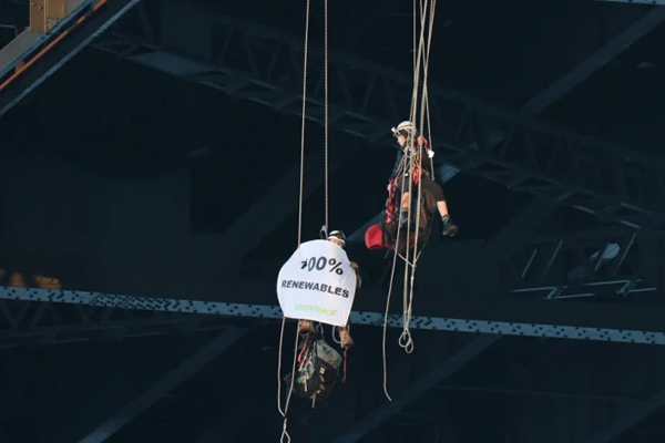 Climate activists abseil from the Sydney Harbour Bridge