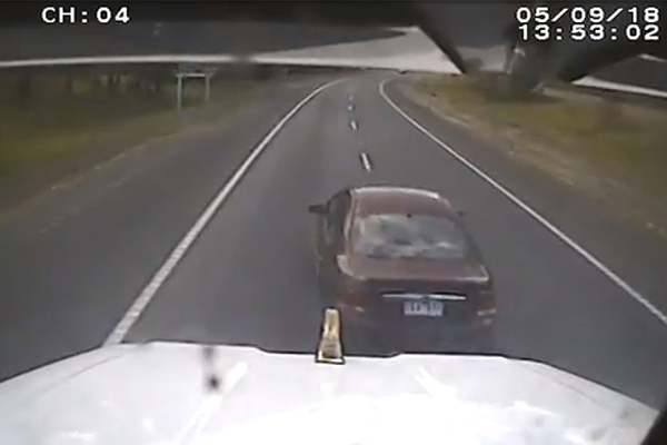 Article image for WATCH | Car tangles with truck in dash cam video