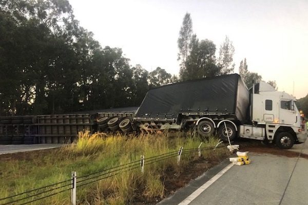 Truck rolls on Pacific Highway, causing major delays