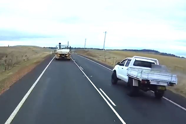 Article image for WATCH | Shocking footage shows ute narrowly miss head-on crash