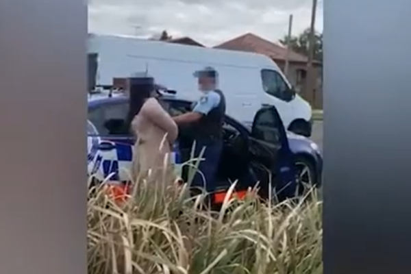 Article image for WATCH | Woman allegedly spits on a police officer