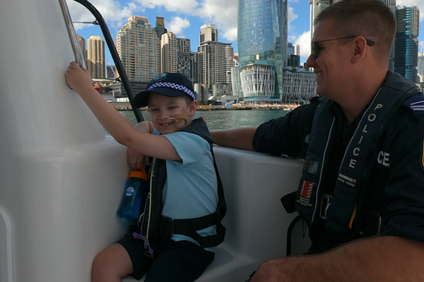 Article image for Young cancer fighter lives his dream day with NSW police