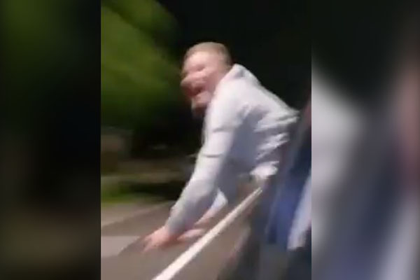 Article image for WATCH | ‘Lunatic’ armed with baseball bat swings at cars in Sydney