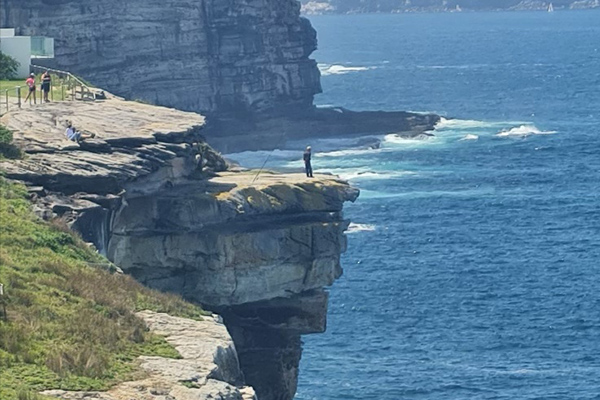 ‘Moron’ spotted fishing off cliff edge in Sydney’s east