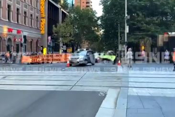 Article image for WATCH | Incredible footage of car crashing through protest banner in Sydney CBD