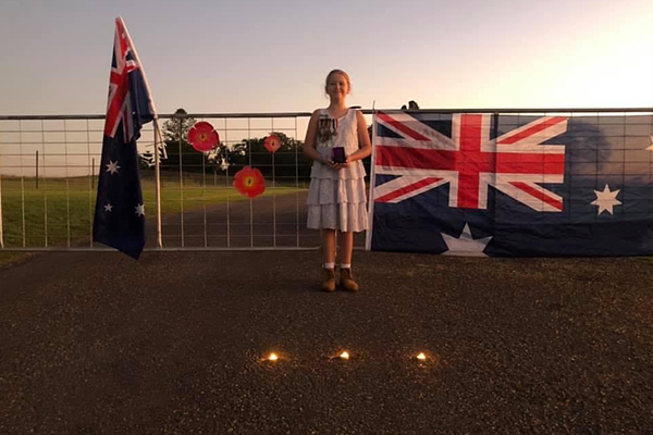 Article image for 10-year-old ‘lights up the dawn’ for ANZAC Day
