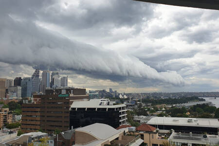 Dark storm clouds roll across Sydney Harbour