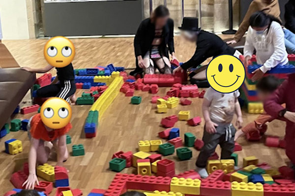 Article image for Australian Museum defends man in women’s underwear while children play with Lego