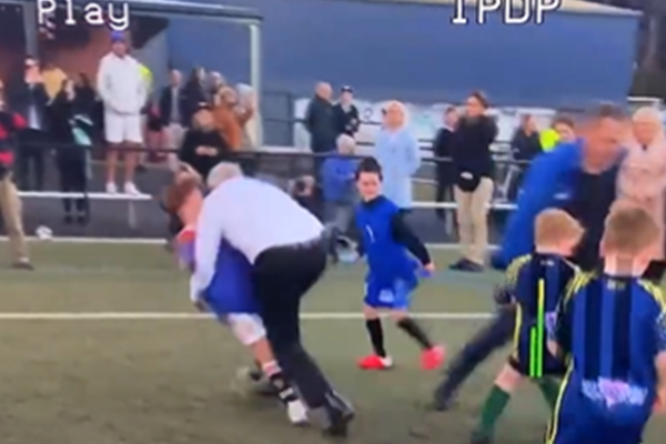 Article image for WATCH | Scott Morrison accidentally crash tackles a child