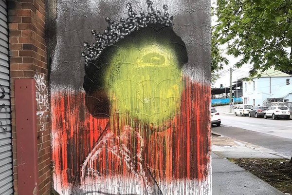 Article image for ‘It’s disgusting’: Mural of the Queen defaced with the Aboriginal flag