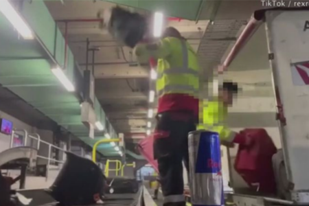 Qantas baggage handlers filmed slamming luggage