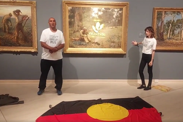 Article image for WATCH | Protestors deface Australian painting with Woodside Energy logo