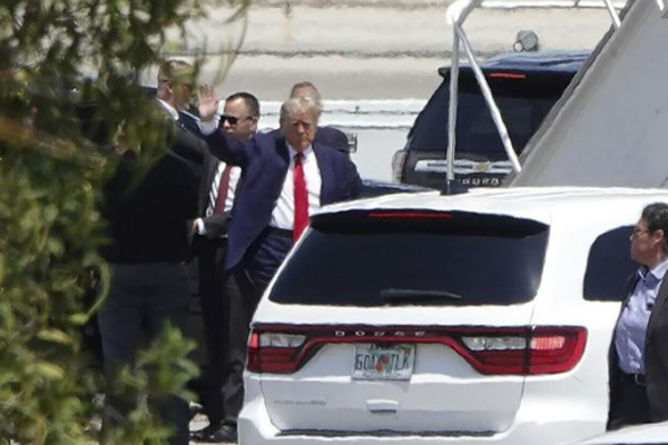 Article image for ‘Pure politics’: Donald Trump arrives in New York to face charges