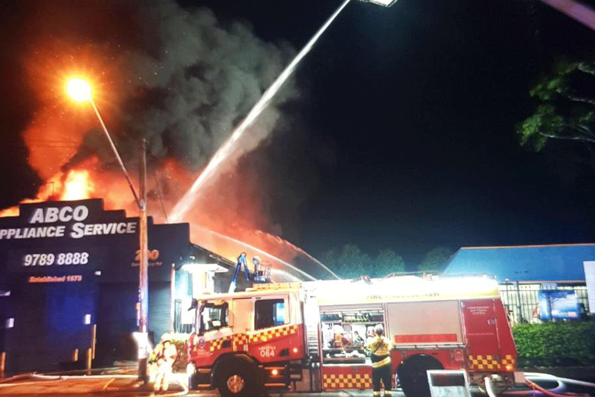 Article image for Roads closed, firefighters battle ‘big’ warehouse fire in Sydney’s southwest
